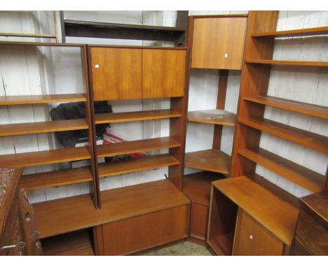 Mid 20th Century G Plan teak suite of modular library furniture comprising:  a corner unit, four two door base units in vario