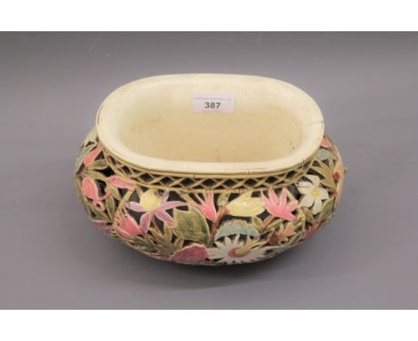 Zsolnay Pecs jardiniere of oval reticulated floral design, impressed and printed marks to base (firing crack to upper rim), 1