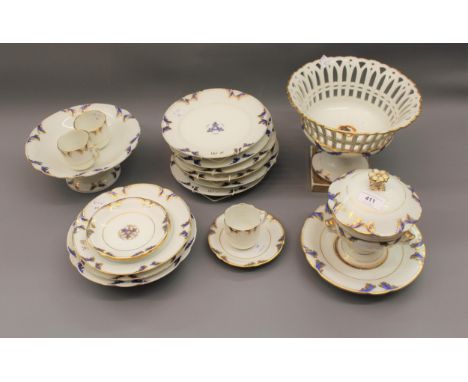19th Century Continental porcelain part dinner and tea service with blue and gilt floral borders and bearing the initials F.M
