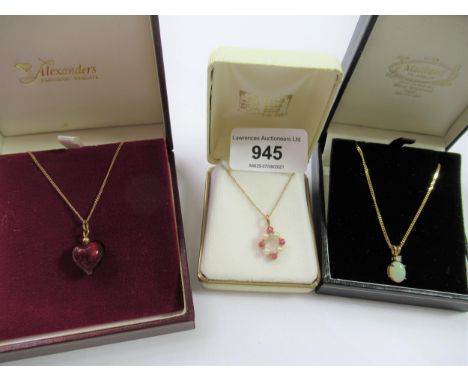 9ct Gold pendant on chain set seed pearls and rubies, 9ct gold pendant on chain set opal and a heart shaped pendant on a 9ct 