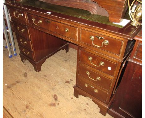 Reproduction mahogany twin pedestal desk with a green tooled leather inset top above drawers with brass swan neck handles, on