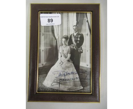 Prince Rainier and Princess Grace of Monaco, signed black and white portrait photograph of the Prince standing, the Princess 