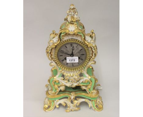 19th Century French porcelain mantel clock, the Rococo design case decorated in pale green, white and gilt, the silvered dial