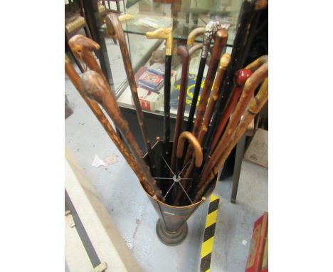 Toleware stick stand in the form of an umbrella containing a quantity of various walking sticks 