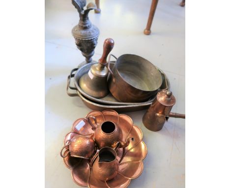 Three various copper two handled cooking pans, beaten copper three piece tea service, bronze hand bell with a turned wooden h