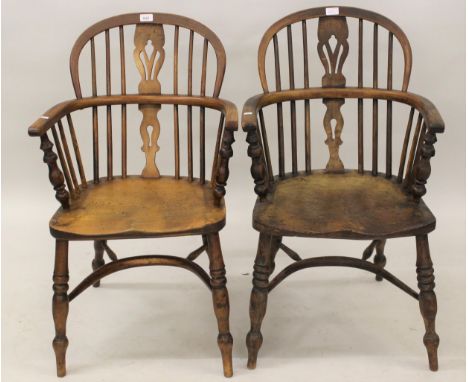Two 19th Century stick and splat back Windsor armchairs on turned supports with crinoline stretchers, one oak and one elm (at