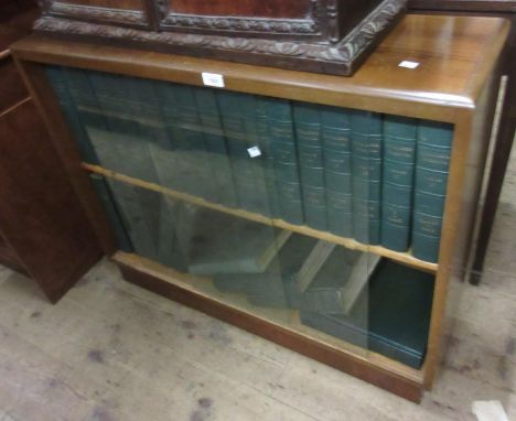 Mid 20th Century bookcase housing a set of Encyclopedia Britannica with leather spines 