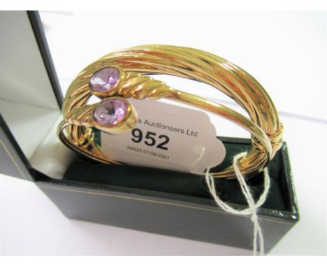 9ct Gold spiral twist bangle together with a yellow metal flexible bangle 