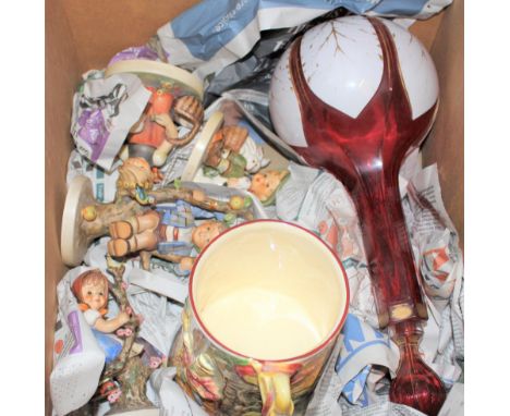 Four various Goebel figures of children (one at fault), together with a pottery musical jug and a Bohemian ruby glass decante
