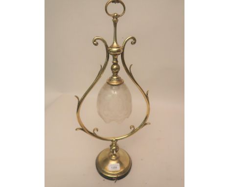 Arts and Crafts brass table lamp with an etched glass adjustable shadeShade is broken and has been re-glued 