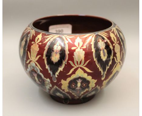 Zsolnay lustre jardiniere decorated with an all-over repeating design on a deep red ground, printed mark to base ' Unique pie