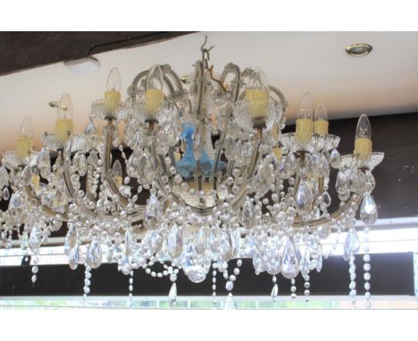 Mid 20th Century glass and gilt brass eighteen light electrolier, the hobnail baluster centre stem surrounded by scroll shape