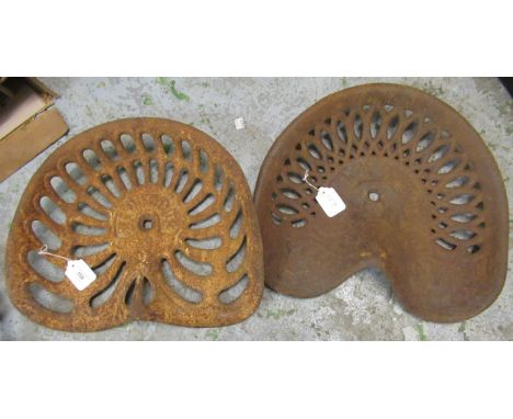 Original Bamfords cast iron tractor seat and another similar 