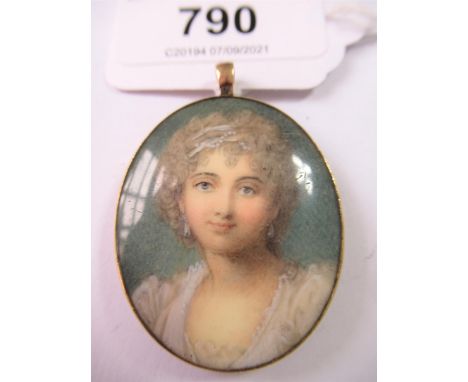 George III oval pendant inset with a painted portrait of a lady 