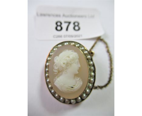 Small glass cameo depicting a classical female head in profile within a split pearl border, 25mm x 20mm approximately 