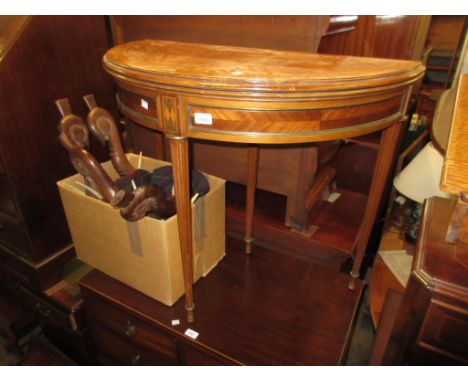 Reproduction mahogany and line inlaid fold-over half round card table on turned fluted supportsRip to leather insert inside, 