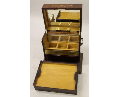 19th Century rosewood floral and urn inlaid decanter / games box having hinged cover, with mirrored and satinwood fitted inte