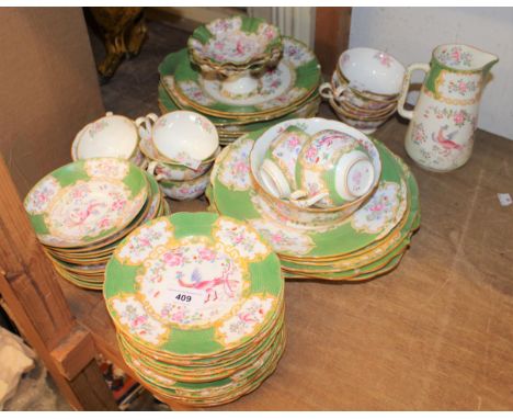 Mintons tea service decorated with panels of exotic birds and flowers on a green ground, fifty pieces approximatelyVarious ch
