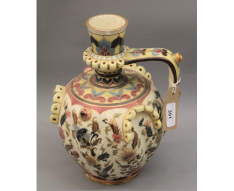 Zsolnay Pecs jug vase with typical floral design on a cream ground (chips to rim and foot rim), 11ins high 