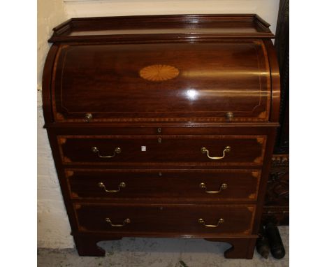 Edwardian mahogany satinwood crossbanded and shell inlaid bureau, the cylinder top enclosing a fitted interior with pull out 