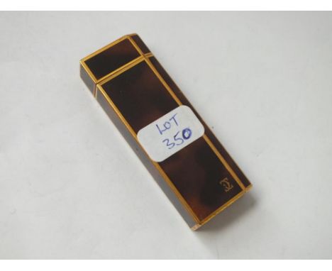 Tortoise shell effect Cartier lighter with gold coloured mounts 
