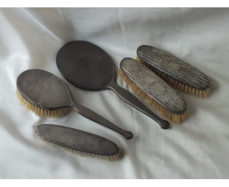 Five piece dressing table set with engine turned backs,  B’ham by H &amp; D       30  