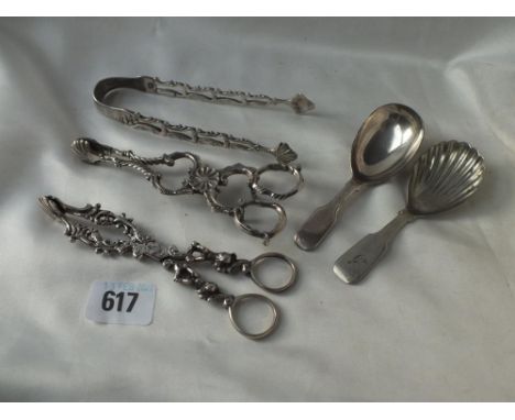 A bag containing a pair of Georgian silver sugar tongs, two plated caddy spoons, etc.      