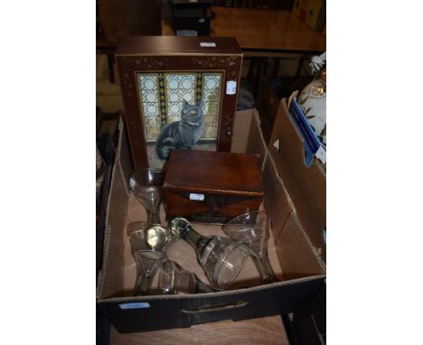 A decorative wooden box with painted inscription, a key cupboard with feline decoration and five glass tea light holders for 