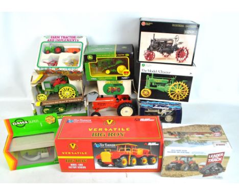A group of boxed tractors including Toy Farmer Versatile Big Roy Model 1080, John Deere Lindeman Crawler with Cultivator, Pre