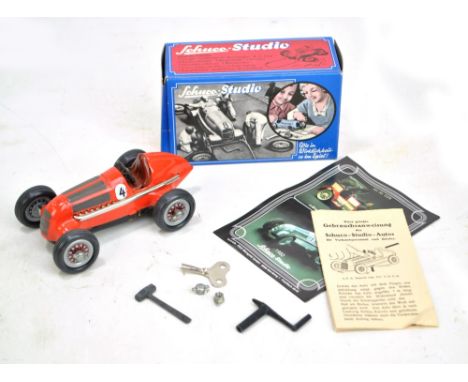 SCHUCO; a boxed Studio 1050 clockwork Mercedes Grand Prix 1936 in red with German language instruction booklet and leaflet (b