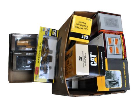 A group of boxed predominantly 1:16 scale construction vehicles including JCB Major Loader MkI Excavator, Caterpillar D2 Trac