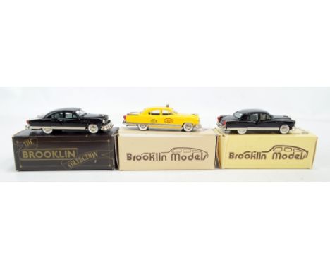 BROOKLIN MODELS; three BRK 29 1953 Kaiser Manhattans in black (x2) and yellow liveries, the latter with 'Taxi' sign and 'Taxi