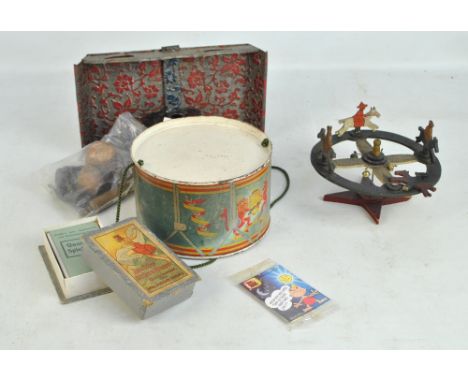 A small group of toys comprising a late 19th century tinplate and wooden kitchen set including toast rack, rolling pin, pots 