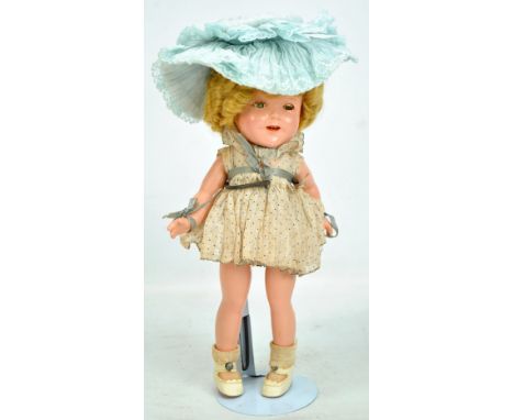 An Ideal Toy Co Genuine Shirley Temple doll with blonde wig, painted features, open/close eyes and open mouth with upper teet