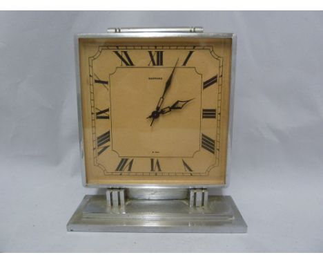 A Garrard 8 Day Art Deco Chromium mantel clock, the square dial with scroll surmount on a stepped plinth base, 16.5cm high