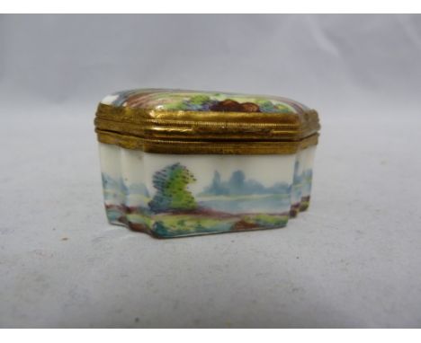 A German gilt metal mounted porcelain snuff box, decorated in 18th Century style with figures in a landscape, 4.8cm max appro