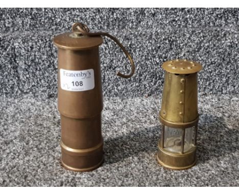 A brass miner's lamp 12cm high, and a solid brass miner's lamp ornament.