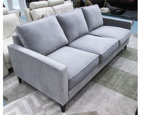 SOFA, three seater in grey fabric on square ebonised supports, 209cm L x 72cm H x 90cm D.