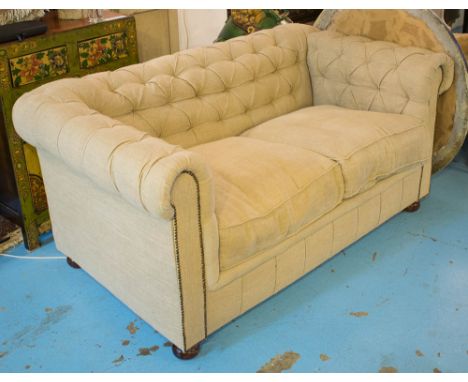 CHESTERFIELD SOFA, two seater, with a buttoned back and oatmeal upholstery on bun feet, 155cm L x 73cm H. (with faults)