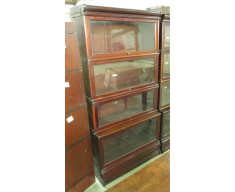 GLOBE WERNICKE BOOKCASE, in four sections, early 20th century mahogany, bears plaques, 87cm W x 39cm D x 173cm H. (with fault