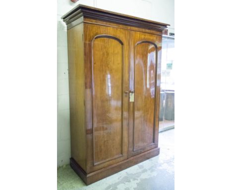 WARDROBE, Victorian mahogany with two arched panelled doors enclosing double hanging and two drawers, 218cm H x 152cm W x 63c