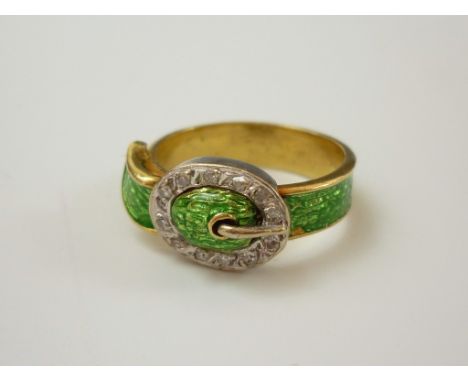 A yellow metal, diamond and emerald-green enamel dress ring, in the form of a belt, having a white metal buckle set with diam