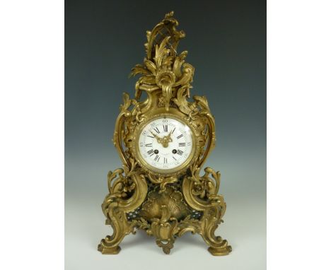 A large late 19th Century French cast brass Rococo style bracket or mantle clock retailed by J Meyer, 31-33 Bd St MartN, Pari