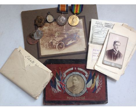 A British War and Victory Medal pair to M2-202245 Pte T Coleman Army, Service Corps, together with identity discs, cap badge,