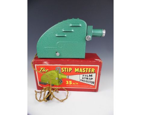 A mid 20th Century Stip Master 35 mm film projector in original carton