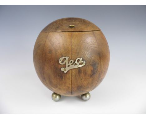 A George V wooden staved and turned bullet-form tea caddy, on four bun feet, 14 cm high 