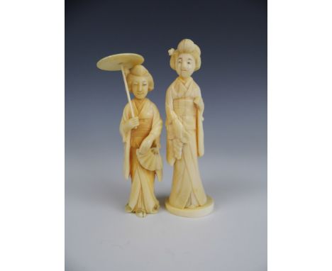 A late Meiji / Taisho ivory netsuke modelled as a geisha, signature to base, together with one other similar, 12.5 cm and 11.