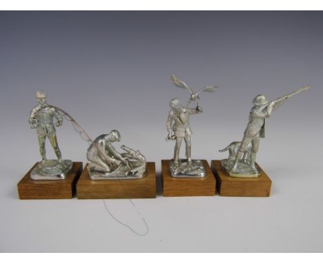 A group of four miniature Welsh silver figures of field sportsmen fishing and hunting, each on wooden plinth base, Ammonite L