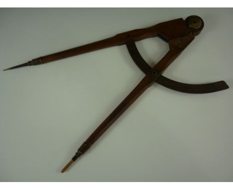 A large 19th Century shipwright's or cabinetmaker's compass in brass and iron mounted mahogany, engraved J Ogolvie, 53 cm