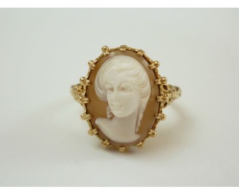 A 9ct gold and cameo ring, bearing a head and shoulders portrait of a young lady with sweeping hair, crown set on a moulded s